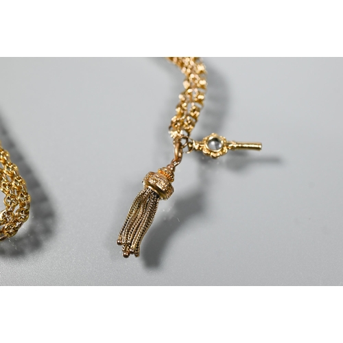 283 - A 9ct yellow gold fancy link guard chain with tassel fob and watch key attached, approx 47.9g all in