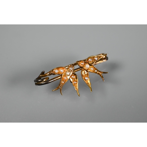 294 - An Art Deco Egyptian Revival enamelled brooch in the form of a winged pharoah, 9cm wide to/w an Edwa... 