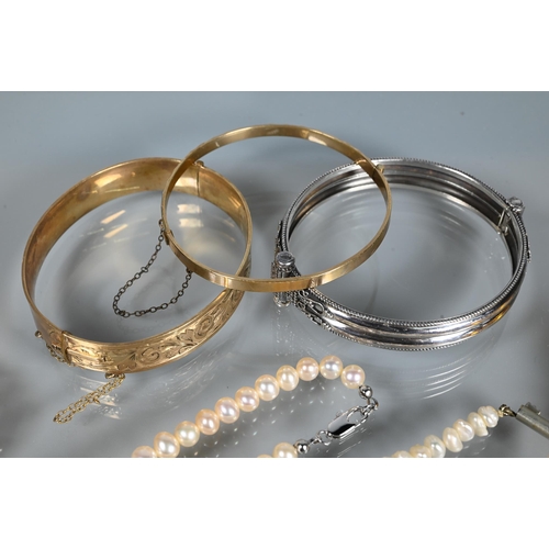 295 - Mixed jewellery including three bangles, five various simulted pearl necklaces, amber necklace, brac... 