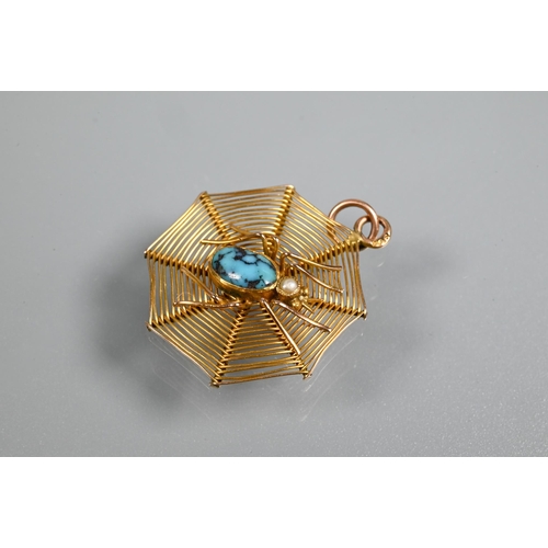 300 - A pendant in the form of a spider on web, the spider with turquoise matrix body and pearl set head, ... 