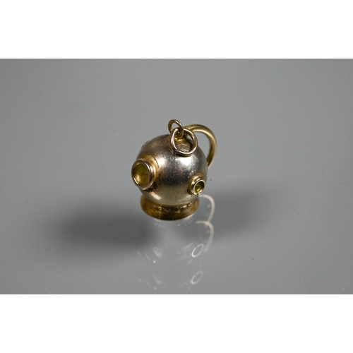 313 - A 9ct divers helmet charm to/w a propelling pencil in the form of a sarcophagus, white metal with po... 