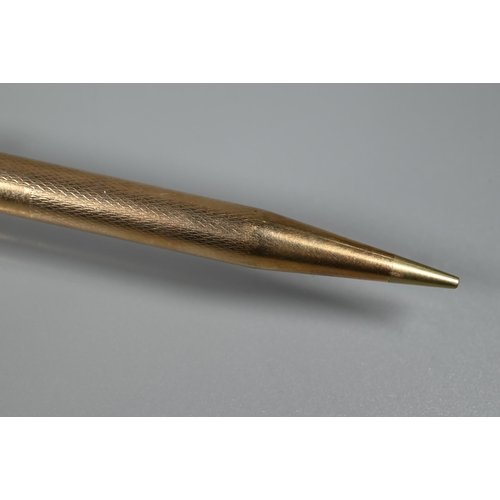 314 - A 9ct yellow gold cased propelling 'Yard-O-led' pencil, engine turned decoration