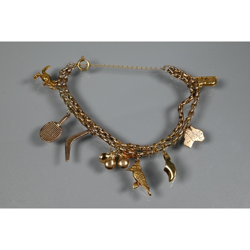 316 - A charm bracelet formed of double belcher chain with eight various charms attached including boomera... 