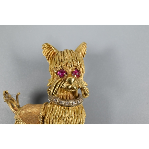 317 - A yellow metal brooch in the form of a standing dog, possibly a Yorkshire terrier, with diamond set ... 