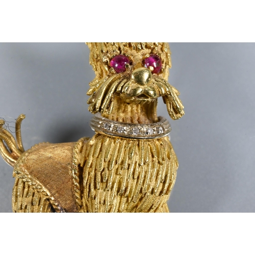 317 - A yellow metal brooch in the form of a standing dog, possibly a Yorkshire terrier, with diamond set ... 