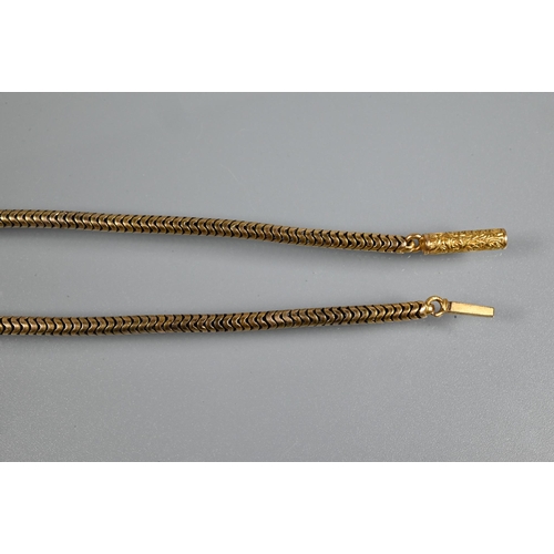 318 - A yellow metal snake-link necklace with engraved cylindrical clasp, unmarked, approx 16g