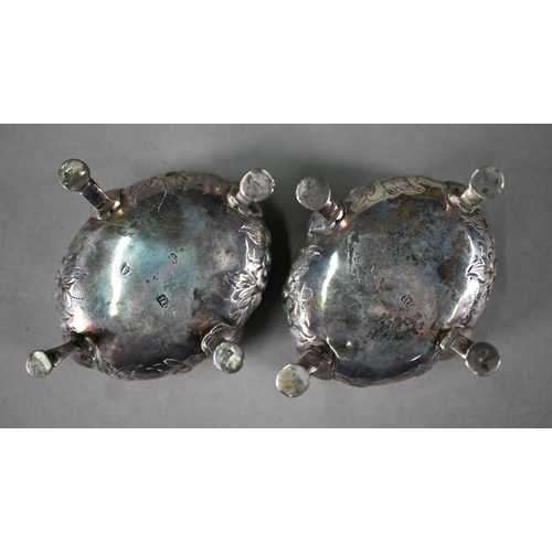 32 - A pair of George III silver oval salts with floral chased decoration and hoof feet (maker's mark rub... 
