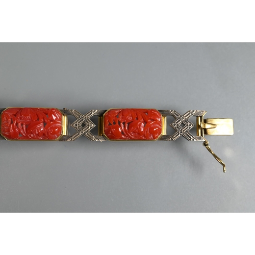 327 - An Art Deco style bracelet formed of carved coral rectangular panels with yellow and white metal geo... 