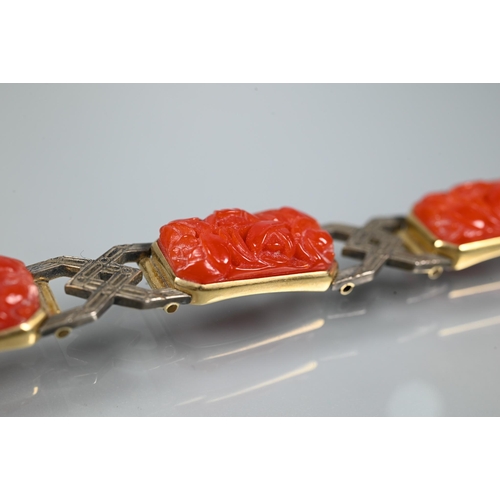 327 - An Art Deco style bracelet formed of carved coral rectangular panels with yellow and white metal geo... 