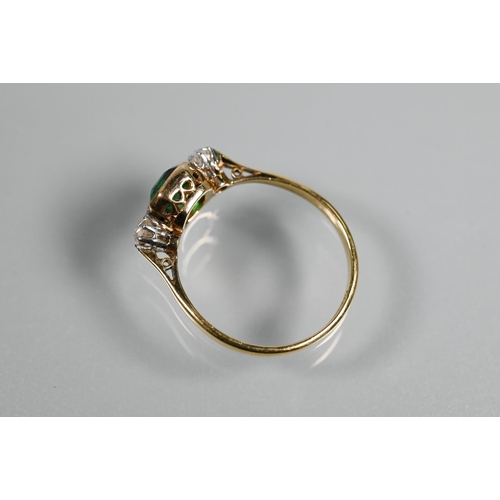 329 - An antique green stone and diamond ring, the central rectangular step cut stone in milgrain setting ... 