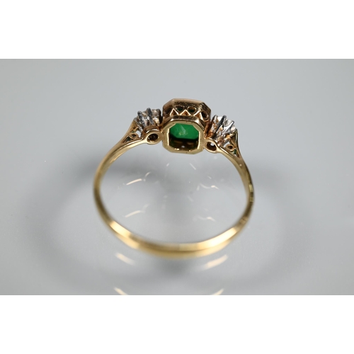 329 - An antique green stone and diamond ring, the central rectangular step cut stone in milgrain setting ... 