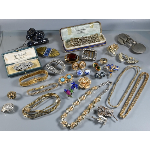 334 - A collection of vintage costume jewellery including paste set dress clips, paste set buckles, gilt m... 