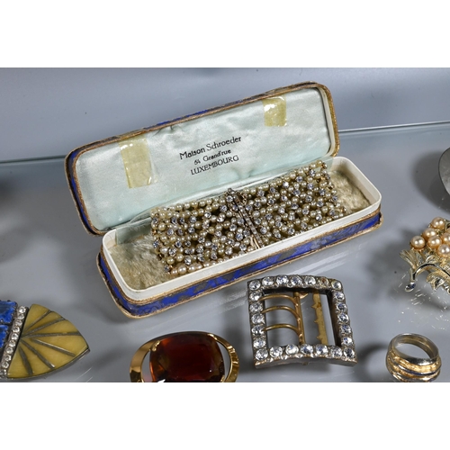 334 - A collection of vintage costume jewellery including paste set dress clips, paste set buckles, gilt m... 