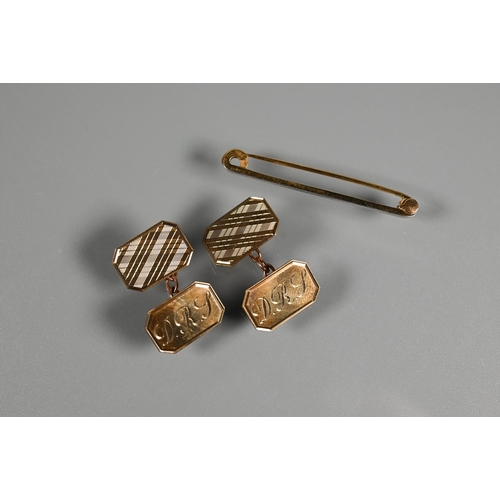 335 - A pair of 9ct yellow gold rectangular cufflinks with engine turned decoration and engraved initials,... 