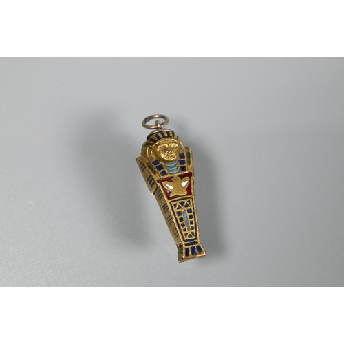 339 - A propelling pencil in the form of a gilt metal and enamel sarcophagus, 3 cm long; a smaller sarcoph... 