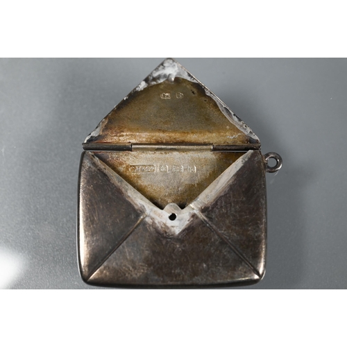 340 - A silver stamp case in the form of an envelope, Birmingham 1897; a silver vinaigrette, Birmingham, d... 