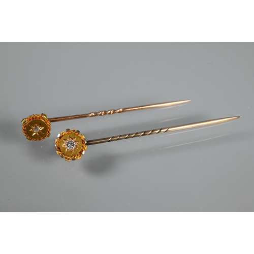 342 - Two Edwardian 15ct yellow gold stick pins, each with inset diamond, 3.4g all in (2)