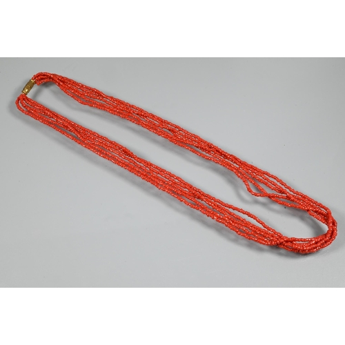 344 - A five strand coral necklace on barrel clasp