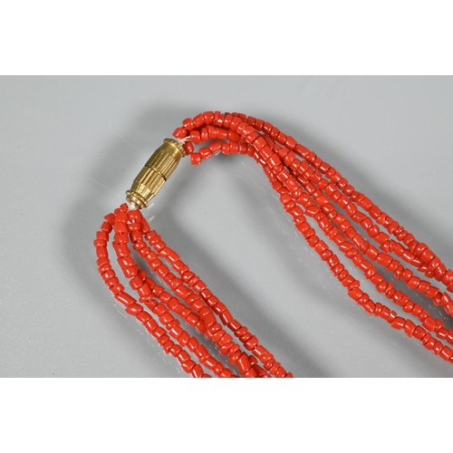 344 - A five strand coral necklace on barrel clasp