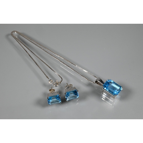 346 - A suite comprising rectangular emerald-cut blue topaz pendant and matching earrings for pierced ears... 