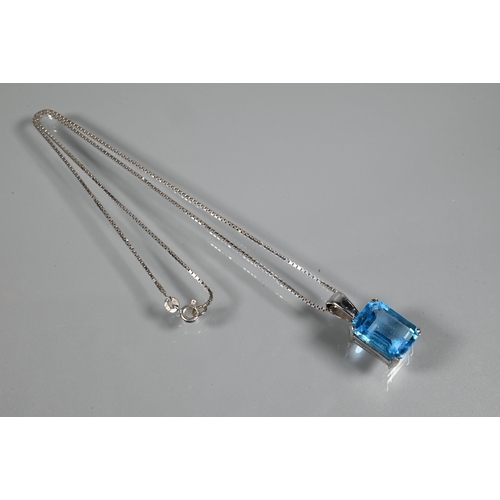 346 - A suite comprising rectangular emerald-cut blue topaz pendant and matching earrings for pierced ears... 