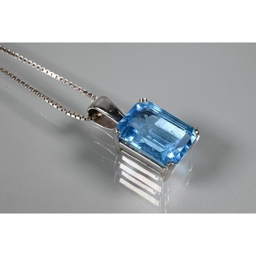 346 - A suite comprising rectangular emerald-cut blue topaz pendant and matching earrings for pierced ears... 