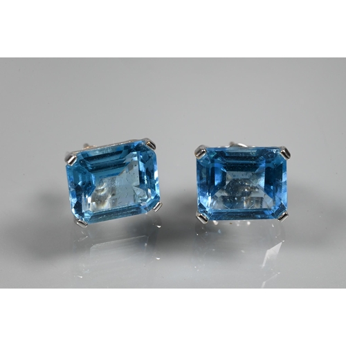 346 - A suite comprising rectangular emerald-cut blue topaz pendant and matching earrings for pierced ears... 