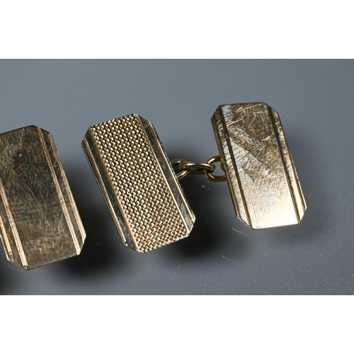 349 - A pair of 9ct yellow gold rectangular cufflinks with chain links and engine turned decoration, in fi... 