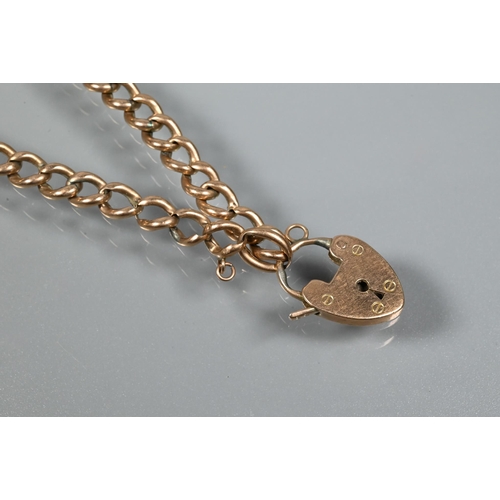 351 - A 9ct rose gold curb bracelet with padlock attached, approx 6.5g