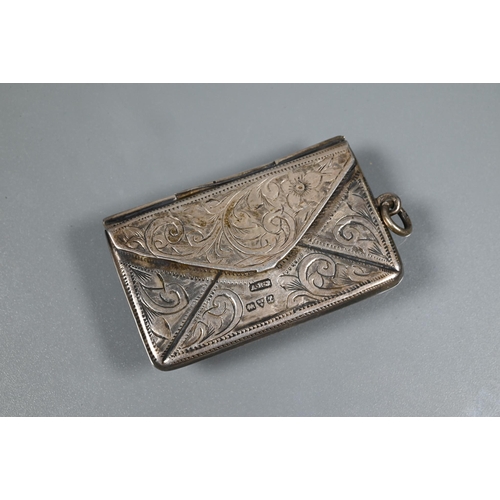 352 - A Victorian silver stamp box in the form of an envelope, with scroll engraved decoration, Chester 19... 