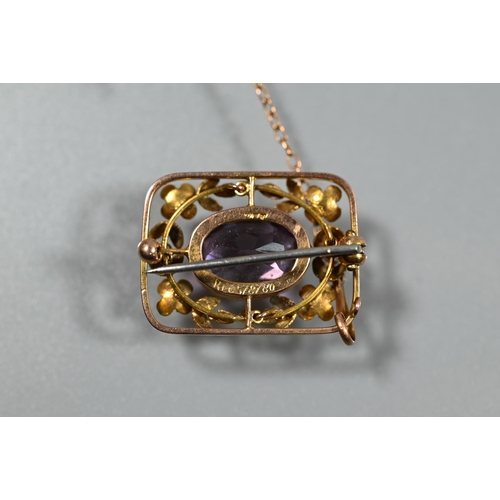 353 - A Victorian 9ct yellow gold brooch, the central oval amethyst surrounded by stylised flower and leaf... 