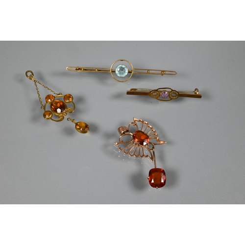 355 - A pendant in the form of a butterfly with open wings, set dark orange stones, possibly fire opals; a... 