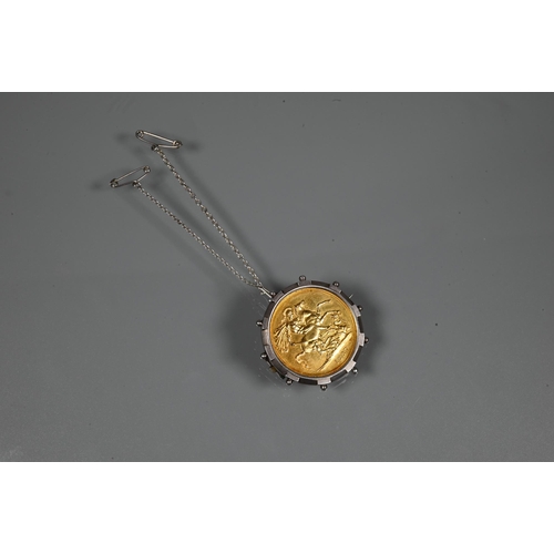 357 - A Victorian gold £2 coin dated 1887, in silver 'spoke' brooch mount, with fitted safety chain