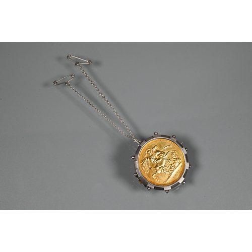 357 - A Victorian gold £2 coin dated 1887, in silver 'spoke' brooch mount, with fitted safety chain