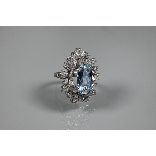 358 - A contemporary statement cluster ring, the oval claw set aquamarine surrounded by an arrangement of ... 