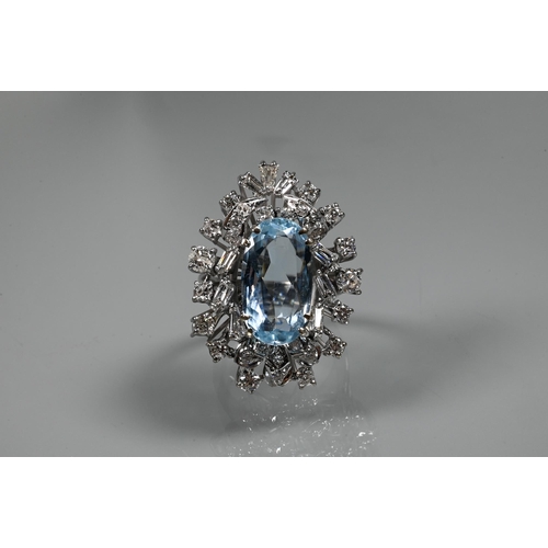 358 - A contemporary statement cluster ring, the oval claw set aquamarine surrounded by an arrangement of ... 