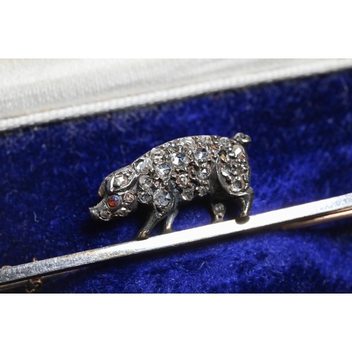 361 - A late 19th century bar brooch with diamond-set pig, the pig pave set with rose cut diamonds and cab... 