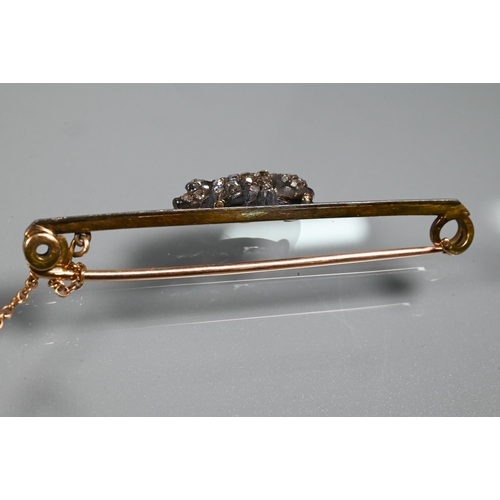 361 - A late 19th century bar brooch with diamond-set pig, the pig pave set with rose cut diamonds and cab... 