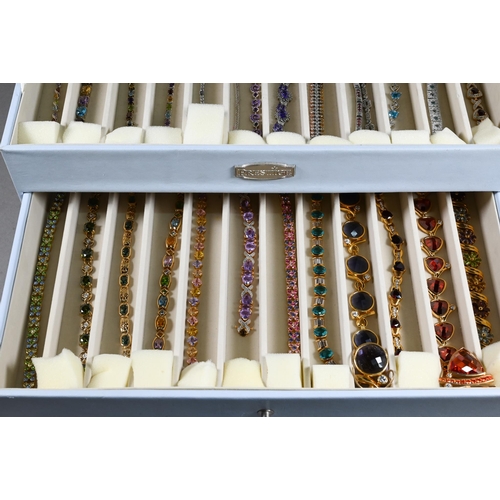 378 - A collection of various simulated gem-set bracelets, mostly stamped 925, in fitted jewel box