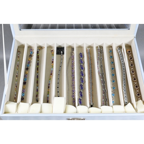 378 - A collection of various simulated gem-set bracelets, mostly stamped 925, in fitted jewel box