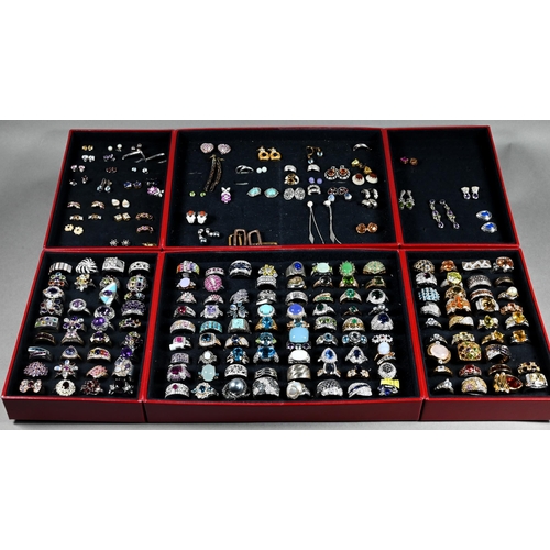 379 - Two jewel cases - one containing a large quantity of various simulated and synthetic gem-set rings, ... 