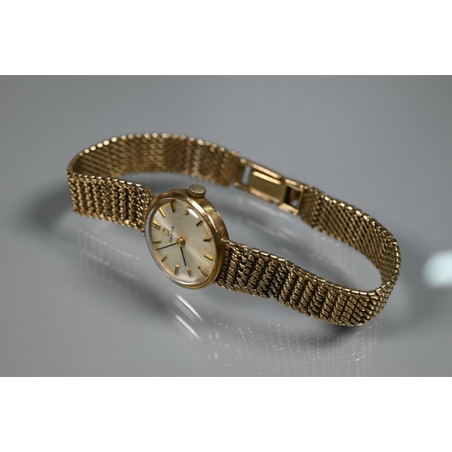 402 - An Omega 9ct gold ladies wristwatch, the champagne dial within a 18mm dia. case (20.4 g all-in) - in... 