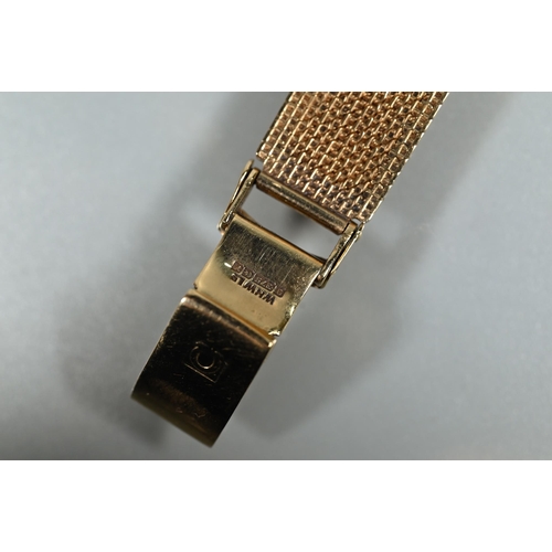 403 - An Omega 9ct gold ladies wristwatch, the 14 mm square case with gilt dial and textured strap (26 g a... 