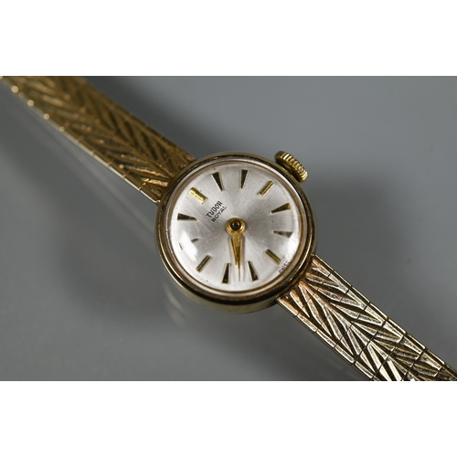 409 - A Tudor 9ct gold ladies wrist watch, champagne dial (approx. 17.1g)