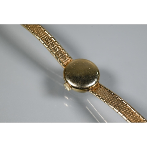 409 - A Tudor 9ct gold ladies wrist watch, champagne dial (approx. 17.1g)