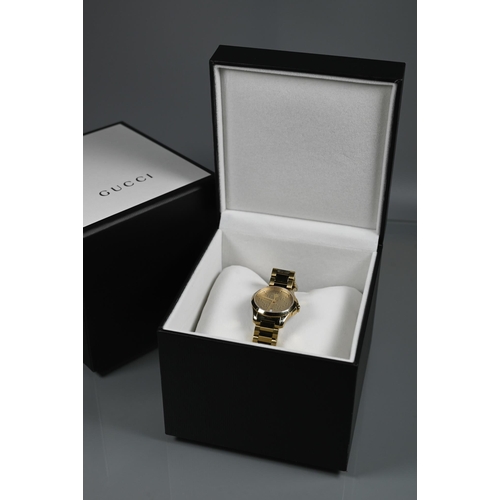 413 - A Gucci wristwatch - SM light yellow diamante circa 2017, boxes with documents, tags, spare links et... 