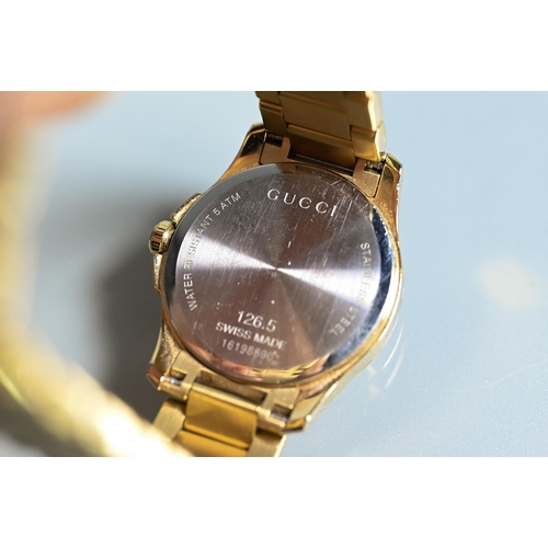 413 - A Gucci wristwatch - SM light yellow diamante circa 2017, boxes with documents, tags, spare links et... 