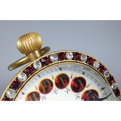 424 - A Victorian style goliath ball desk clock, the white dial with part enamelled Arabic hour markers, a... 