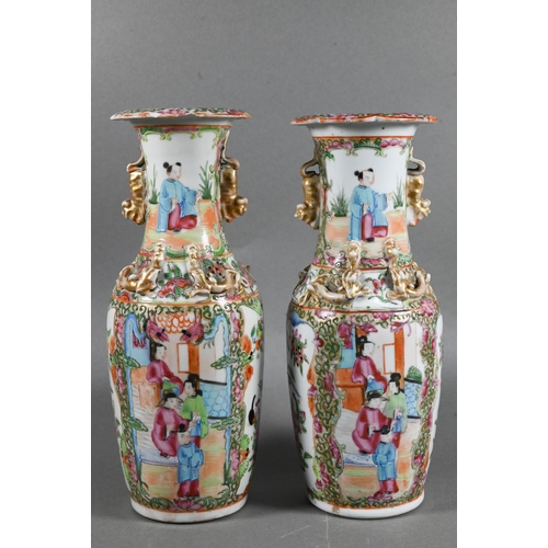 430 - A pair of 19th century Chinese Canton famille rose baluster vases with everted foliate rims, applied... 