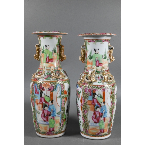 430 - A pair of 19th century Chinese Canton famille rose baluster vases with everted foliate rims, applied... 